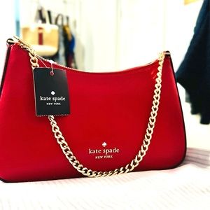 Original Kade Spade Red brand new with tag and store bag. $99